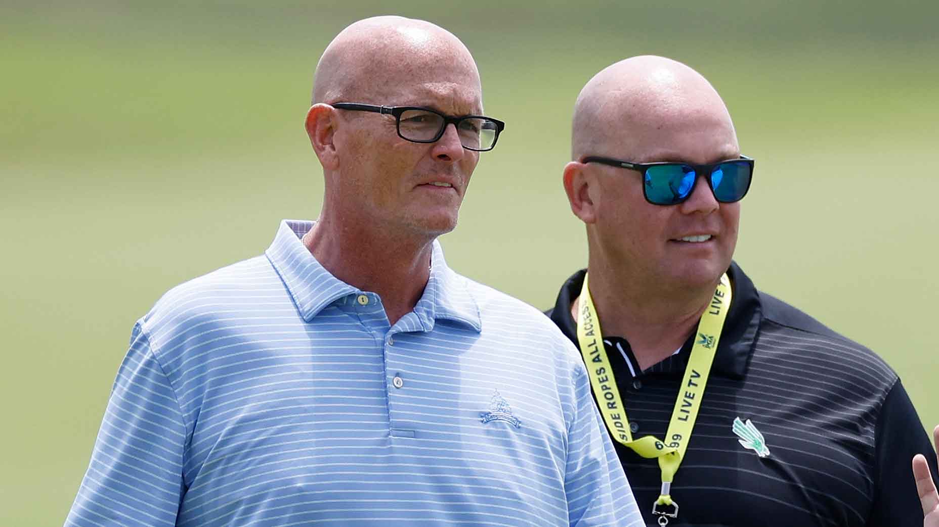 Brooks Koepka talks to Scott Van Pelt and Steve Coughlin during a practice round prior to the 2024 PGA Championship on May 13, 2024, at Valhalla Golf Club in Louisville, Kentucky.
